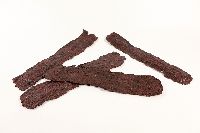Replicas of four strips of beef jerky.